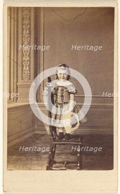 Little girl standing on a chair, 1865-1875. Creator: Frederick Downer & Sons.