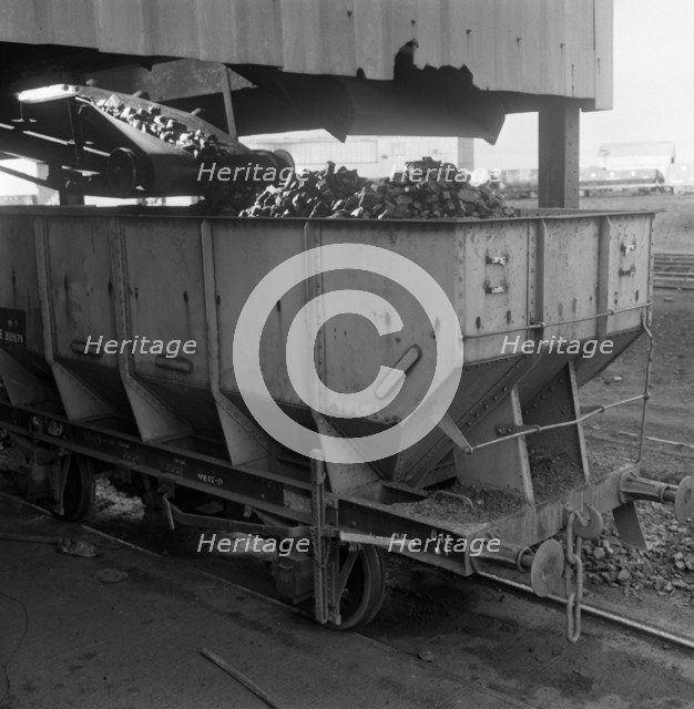 A rail truck being loaded with coal, Lynemouth Colliery, Northumberland, 1963. Artist: Michael Walters