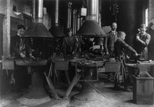 Metal shop (blacksmithing) class in a Washington, D.C., high school, (1899?). Creator: Frances Benjamin Johnston.