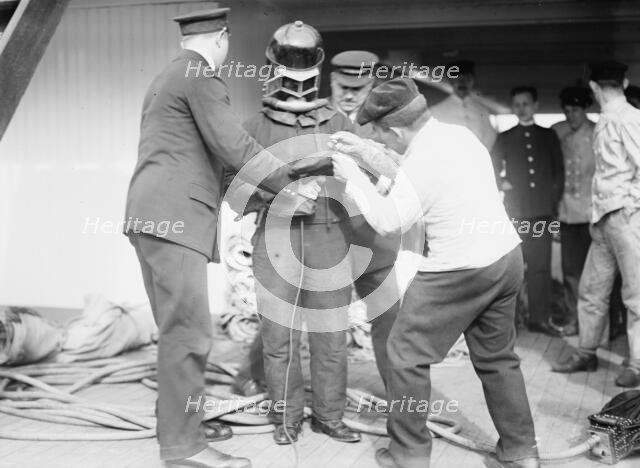 On KAISER WILHELM II - Buttoning up a fire-fighter, between c1910 and c1915. Creator: Bain News Service.