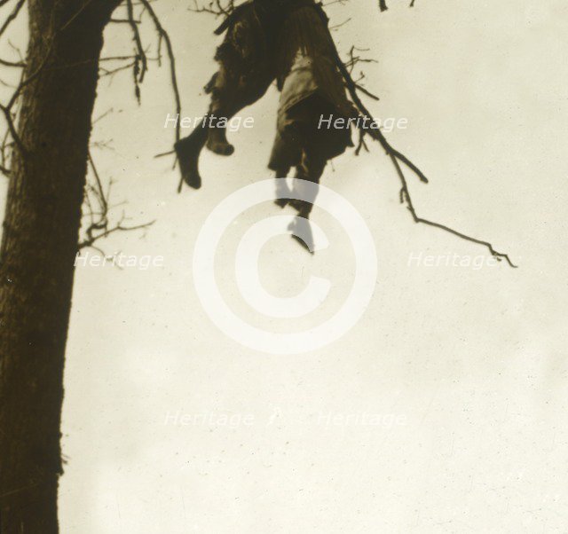 Body in tree, Bois d'Avocourt, Verdun, northern France, c1914-c1918.  Artist: Unknown.