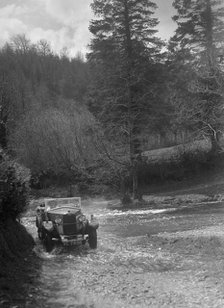 Kitty Brunell road testing a Riley 9 WD tourer, c1930. Artist: Bill Brunell.