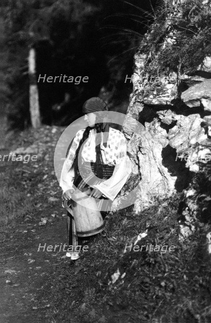 Young woman holding a jug, Bistrita Valley, Moldavia, north-east Romania, c1920-c1945. Artist: Adolph Chevalier
