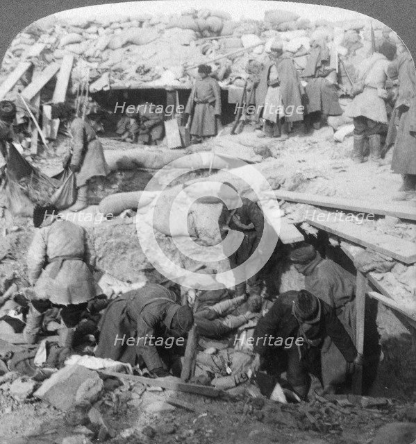 Russians burying Japanese dead inside a fort, Port Arthur, Manchuria, Russo-Japanese War, 1905. Artist: Underwood & Underwood