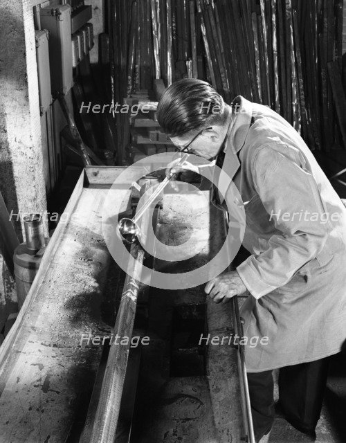 Crack detection on steel bars at J Beardshaw & Sons, Sheffield, South Yorkshire, 1963.  Artist: Michael Walters