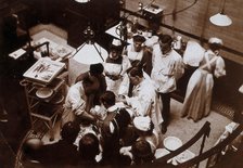Charing Cross Hospital: Stanley Boyd in the old operating theatre, 1900 (1906). Creator: Unknown.