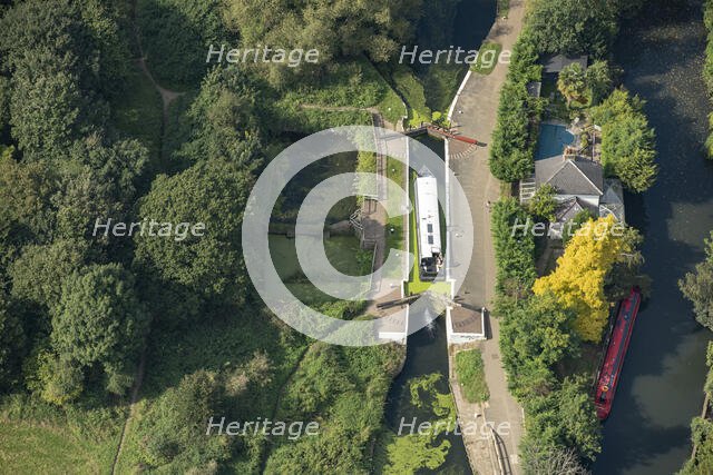 A widebeam canal boat ascending the Hanwell Lock Flight on the Grand Union Canal, London, 2021. Creator: Damian Grady.