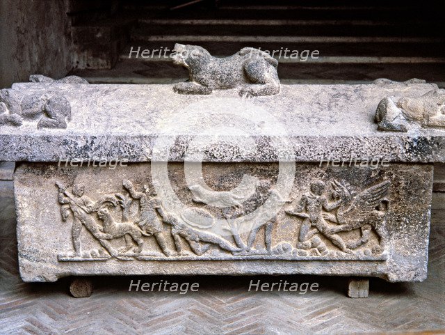 Etruscan stone sarcophagus with reliefs of Eastern influence.