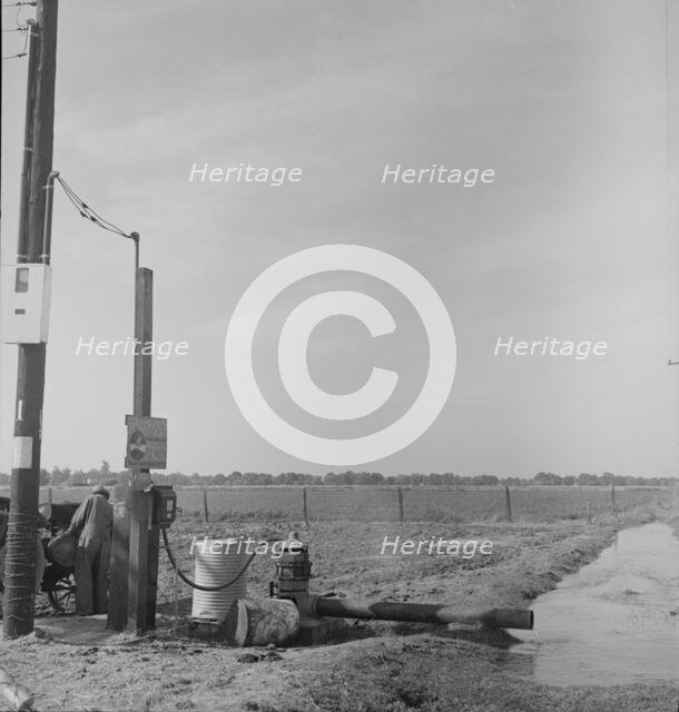 Irrigation pump on edge of field, San Joaquin Valley, California, 1938. Creator: Dorothea Lange.