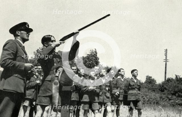 RAF personnel learning to fire guns during the Second World War, 1941. Creator: Charles Brown.
