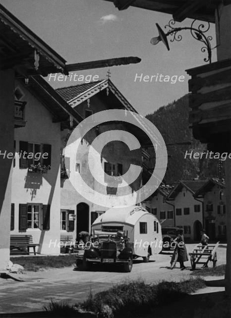 1937 Mercedes Benz 260D Cabriolet towing caravan. Creator: Unknown.