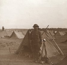 Soldier standing by tent, American camp, Melette, France, c1914-c1918.  Artist: Unknown.