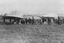 Hubert Latham prepares to take off after Louis Bleriot, near Calais, France, 25 July 1909. Artist: Unknown