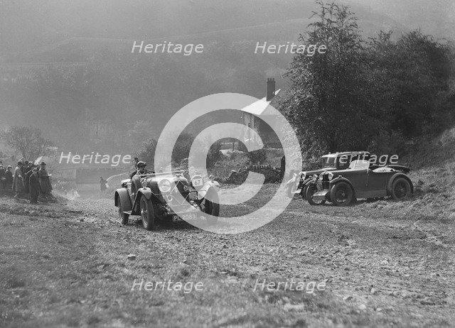 Lagonda of Lord de Clifford passing two MG M types during the MCC Sporting Trial, 1930. Artist: Bill Brunell.