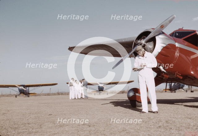 Civilian training school, students and instructors, Meacham Field, Fort Worth, Tex., 1942. Creator: Arthur Rothstein.