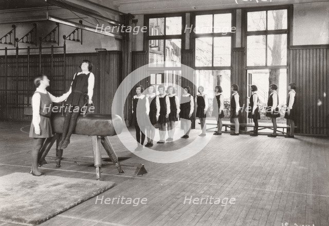 Rowntree girls in an indoor gymnastics class, 1930. Artist: Unknown