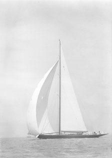 'Britannia' sails downwind under spinnaker, 1935. Creator: Kirk & Sons of Cowes.