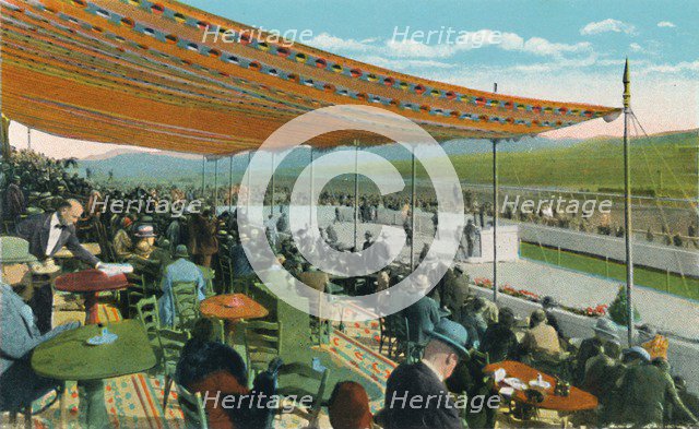 'Watching the Races in front of Club House, Agua Caliente Jockey Club', c1939. Artist: Unknown.