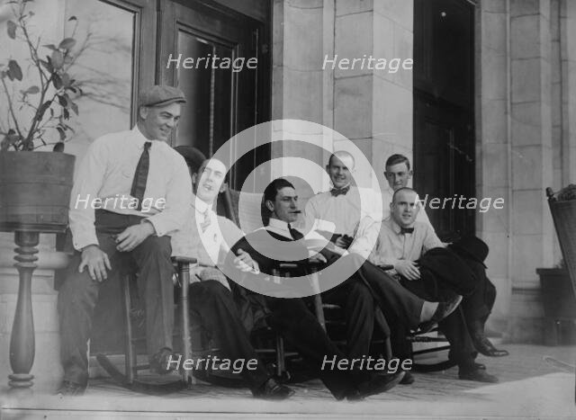 Six Cleveland ball players seated on porch, 1910. Creator: Bain News Service.