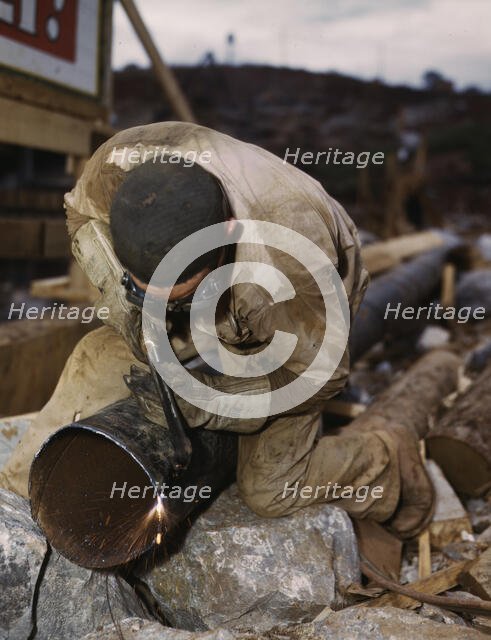 Welder at work on Douglas Dam, Tenn. (TVA), 1942. Creator: Alfred T Palmer.