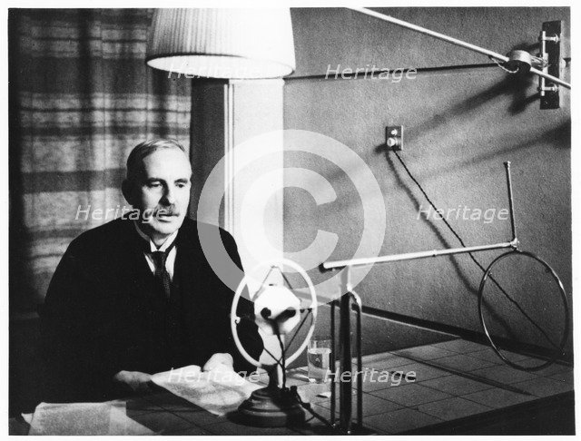 Ernest Rutherford broadcasting during a home visit to New Zealand in 1926.   Artist: Anon