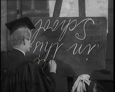 The Entertainer Will Hay...Writing upside down on a Blackboard,1920s Creator: British Pathe Ltd.