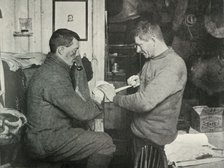 'Petty Officer Evans Binding Up Dr. Atkinson's Hand', 5 July 1911, (1913). Artist: Herbert Ponting.