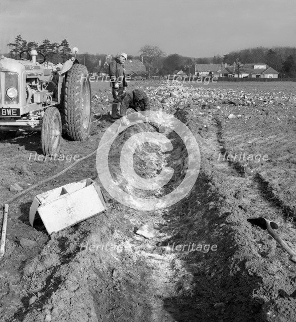 Contractors setting explosives in a trench in Firbeck, near Rotherham, 1962.  Artist: Michael Walters