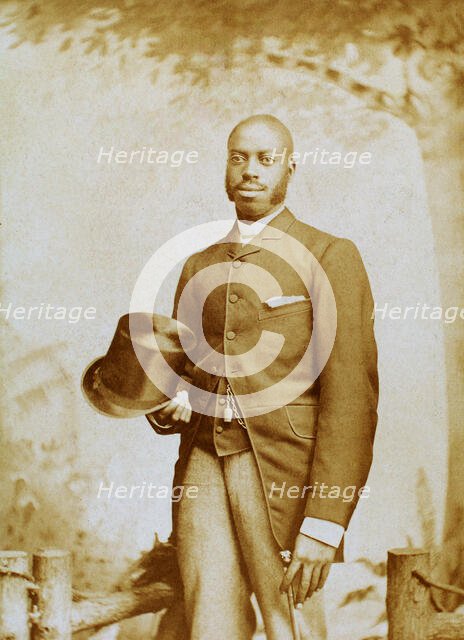 Studio portrait of man with top hat and cane, c1880-c1889. Creator: George E. Curtis.