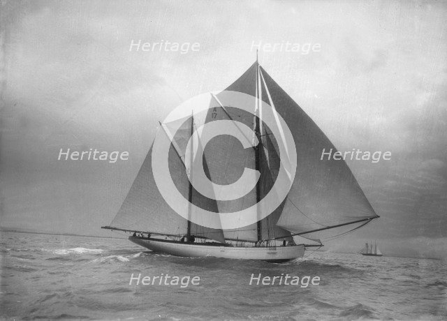 The 118 foot racing yacht 'Cariad', 1912. Creator: Kirk & Sons of Cowes.