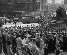 Crowds Watching a Military Band March in Trafalgar Square, 1940. Creator: British Pathe Ltd.