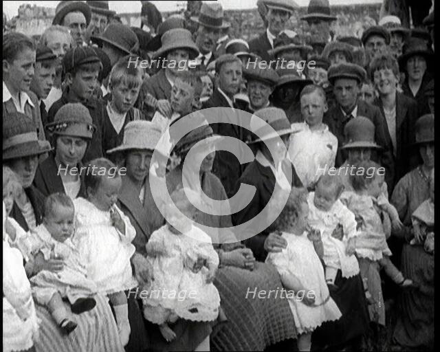 British Mothers Sitting With Their Babies on Their Laps at a Baby Show, 1920. Creator: British Pathe Ltd.