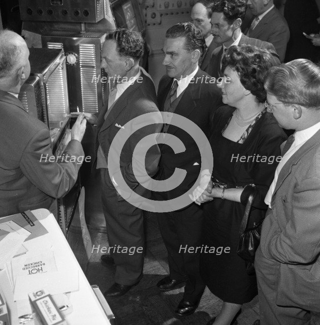 Viewing new barbeque ovens, Wilsic, near Doncaster, South Yorkshire, 1961.  Artist: Michael Walters