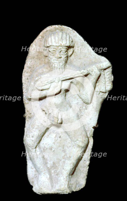 Babylonian terracotta figure of a male musician. Artist: Unknown