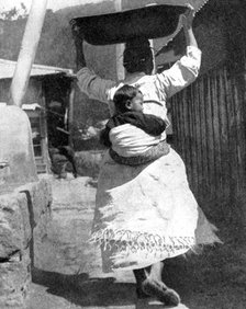 A Korean woman carrying a baby on her back, 1936.Artist: Wide World Photos
