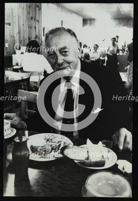 Drummer Max Abrams enjoying a plate of fish and chips in a Soho chip shop, London, 1983. Artist: Denis Williams