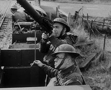 British Soldiers Manning a Machine Gun on an Improvised Armoured Miniature Train, 1940. Creator: British Pathe Ltd.