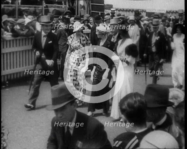 Well Dressed Men and Women at a Race Meeting, 1933. Creator: British Pathe Ltd.
