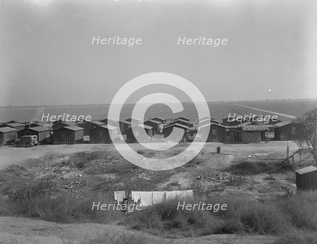 Company housing for Mexican cotton pickers, South of Corcoran, California, 1936. Creator: Dorothea Lange.