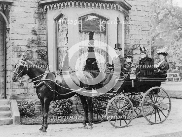Women and a coachman in a pony and trap, late 19th century. Artist: Unknown