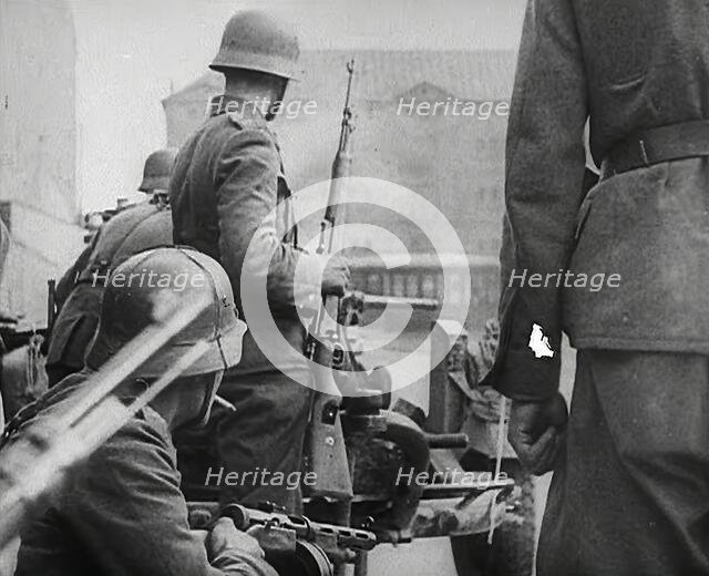 German Soldiers in a Bomb-Damaged Town, 1941. Creator: British Pathe Ltd.
