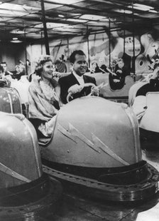 Richard Nixon and his wife Pat on the bumper cars at the Tivoli Gardens, Copenhagen, July 1962. Artist: Unknown