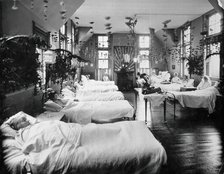 A women's ward in an unidentified hospital, with elaborate decorations. Creator: Unknown.