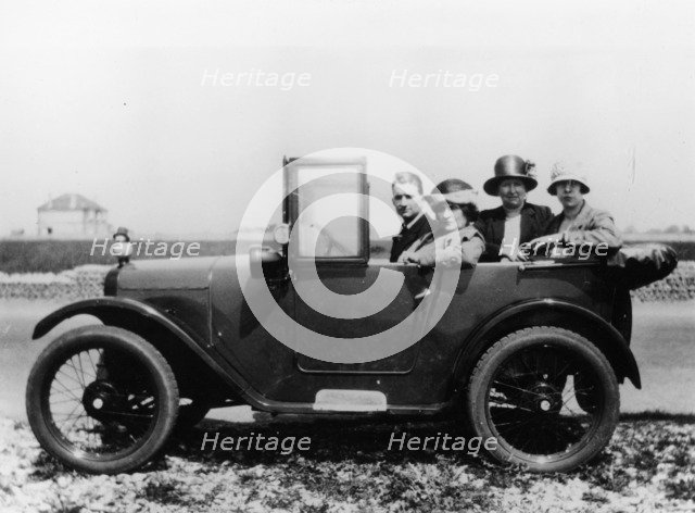 An Austin Seven Chummy with passengers, 1925. Artist: Unknown