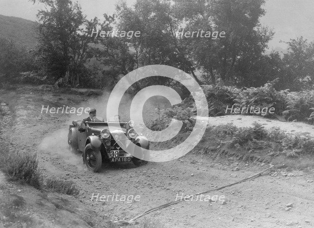 Riley tourer competing in the Barnstaple Trial, c1935. Artist: Bill Brunell.