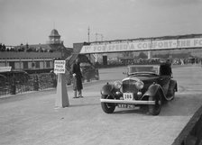 Bentley drophead coupe with Barker body competing in the JCC Rally, Brooklands, Surrey, 1939. Artist: Bill Brunell.