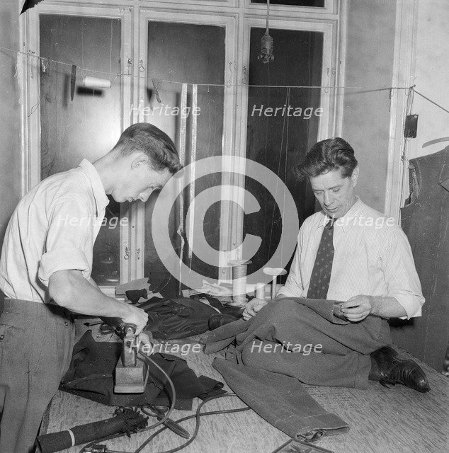 Tailors sewing and ironing, Landskrona, Sweden 1952. Artist: Unknown