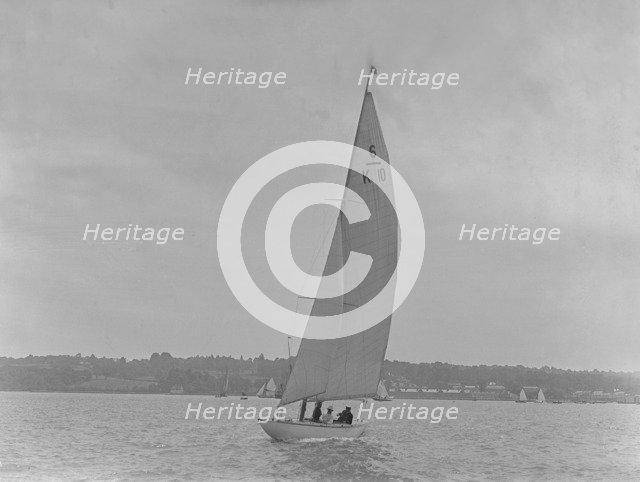 The 6 Metre yacht 'Polly' (K10) sailing upwind, 1921. Creator: Kirk & Sons of Cowes.