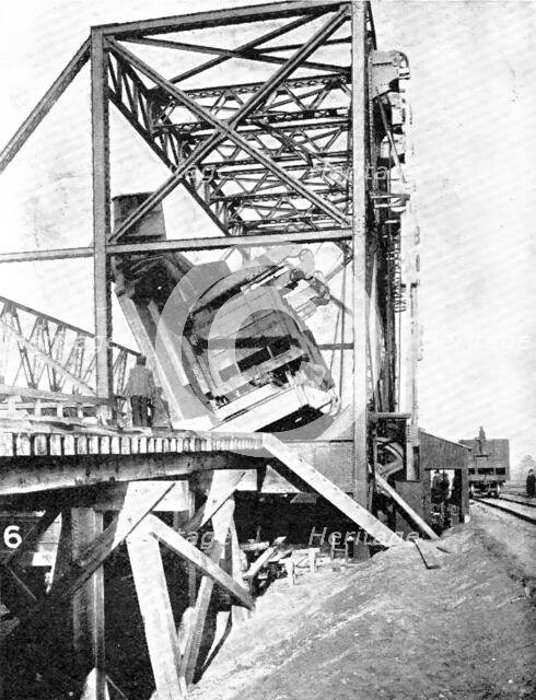 The dumper that overturns a coal-truck every two minutes...remarkable machine..., 1909. Creator: Blauvelt.