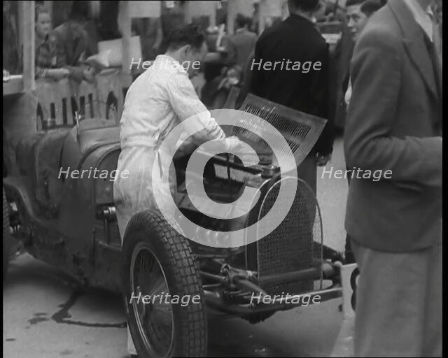 Man Fixing a Racing Car, 1936. Creator: British Pathe Ltd.